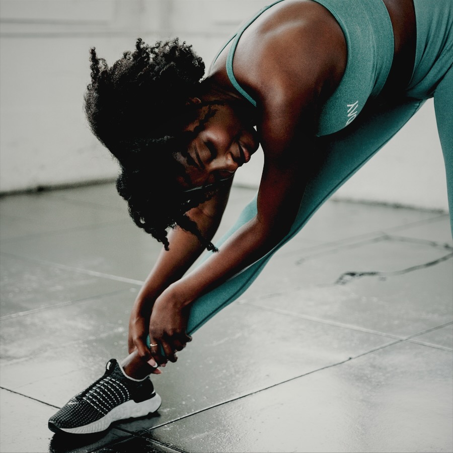 Athlete stretching on the gym floor