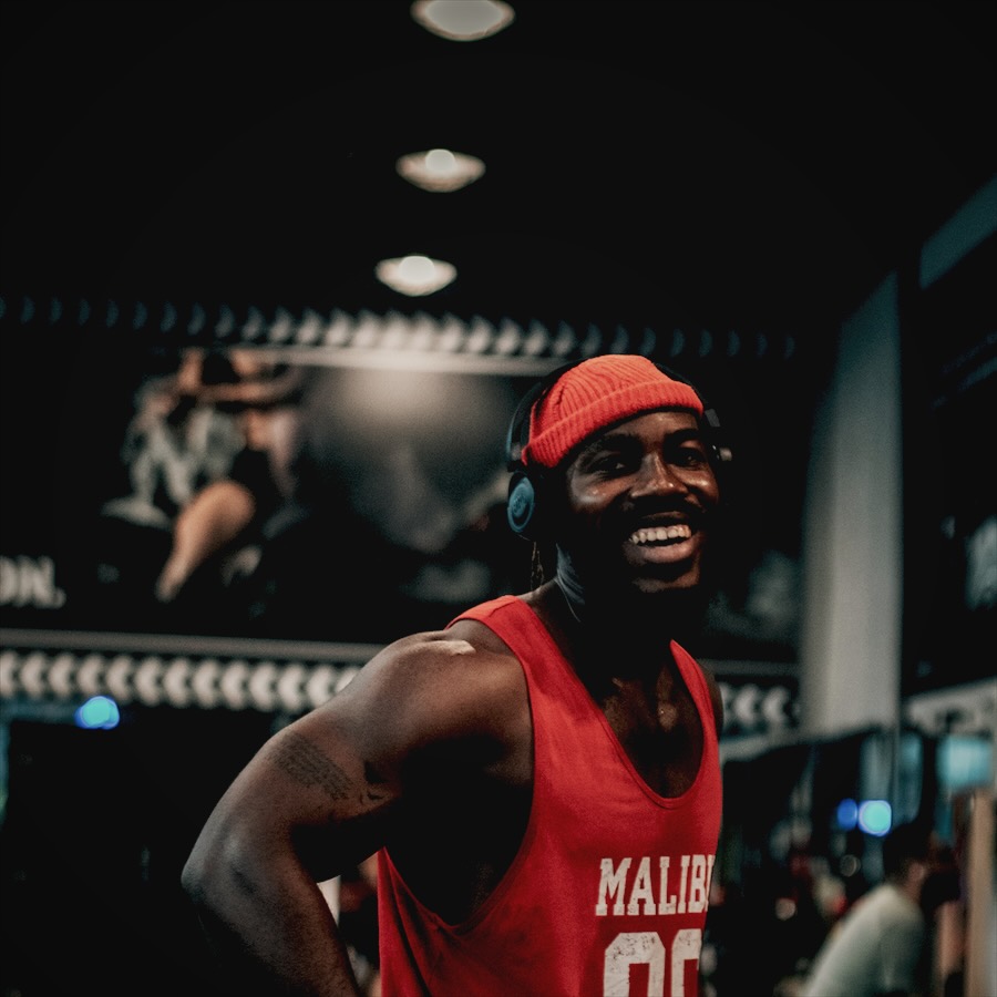 Smiling athlete in a red tank top