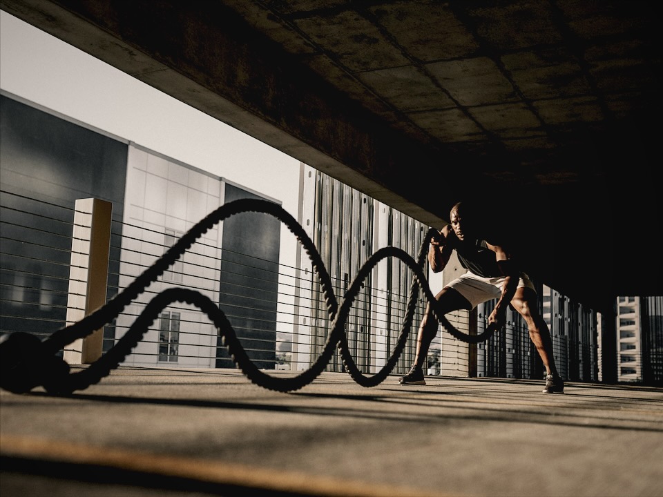 Battle ropes workout in a parking garage